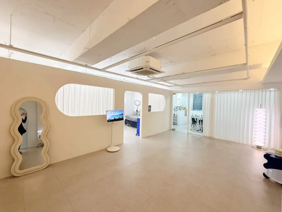 Bright interior with cream-colored walls and curved design