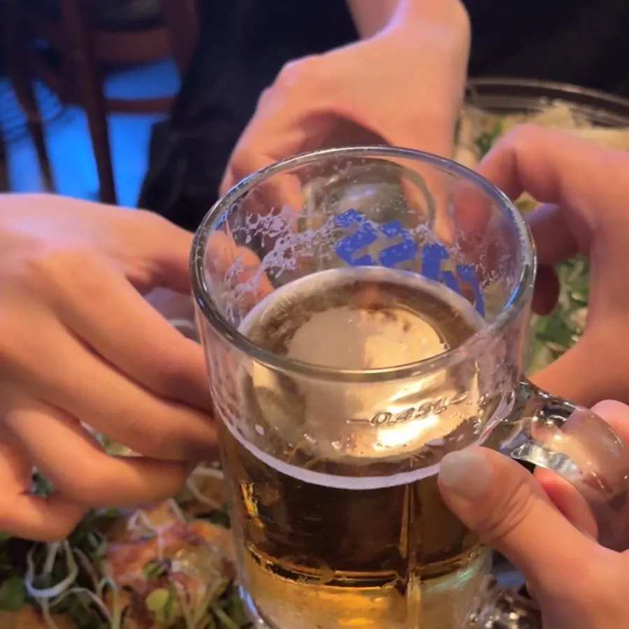 Toasting with glasses of frosty draft beer