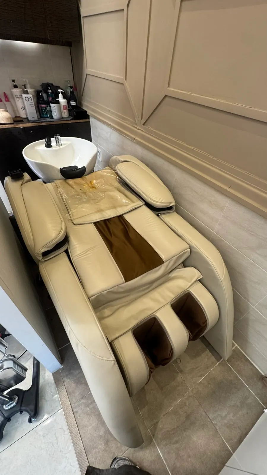 A massage chair seat in the shampoo zone