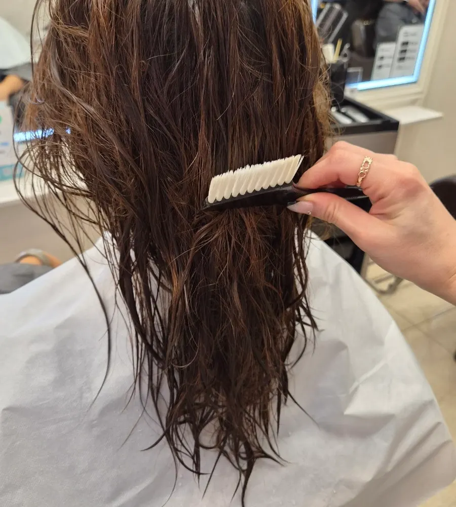 Before condition of hair damaged from repeated dyeing and perming