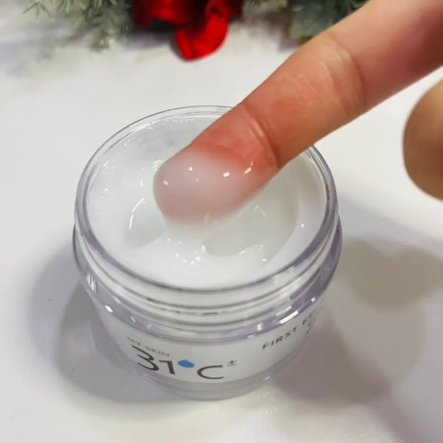 Hyaluronic acid cream being spread over skin