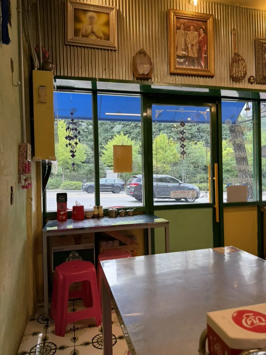 Cozy seating and interior of Drunken Thai Sangam Branch