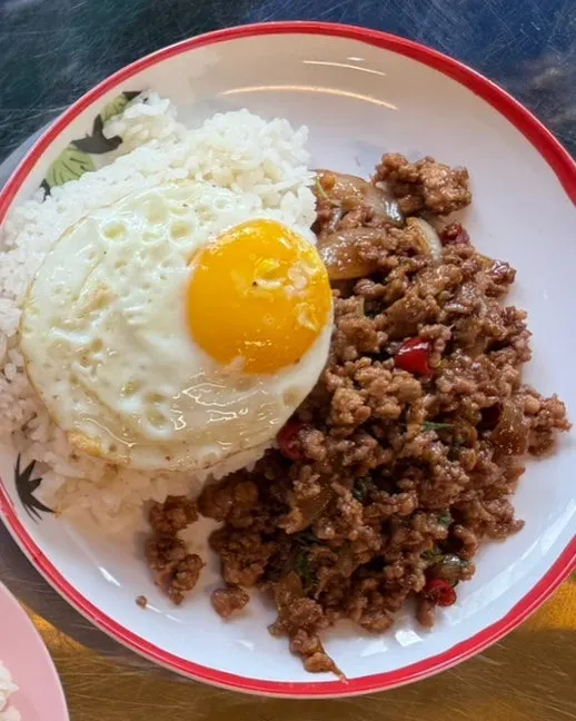 Plate of pad kra pao moo sap, stir-fried pork with basil