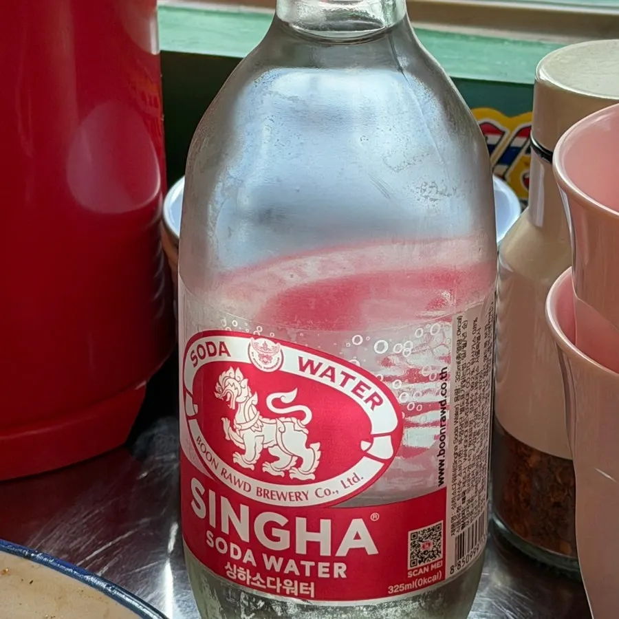 Singha Soda Water given as a complimentary treat