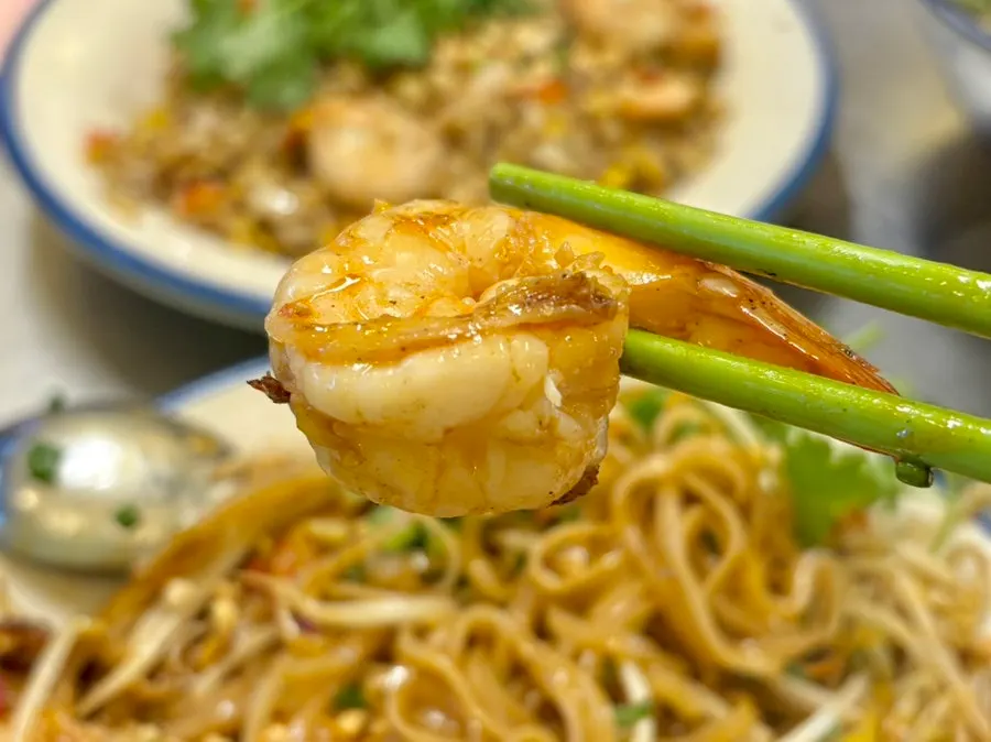 Seafood pad thai topped with plenty of shrimp and bean sprouts