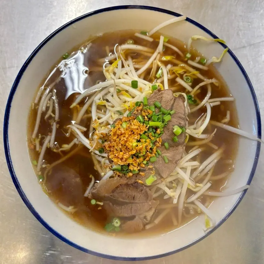 Steaming bowl of Drunken Thai's beef pho