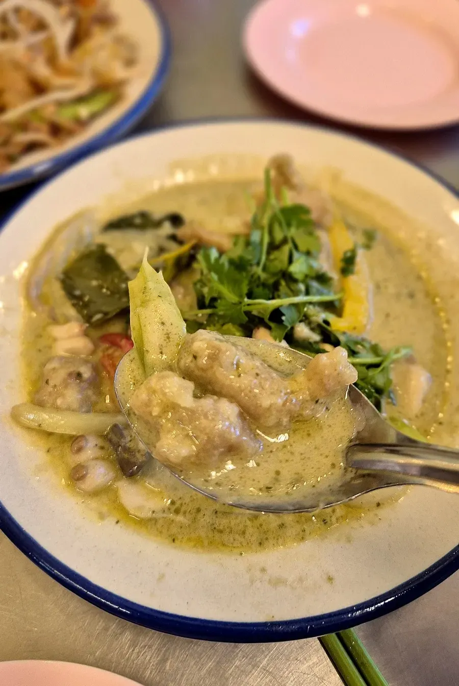 Green curry eaten with rice