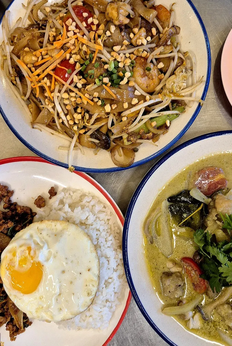 Table spread with all three Thai dishes together