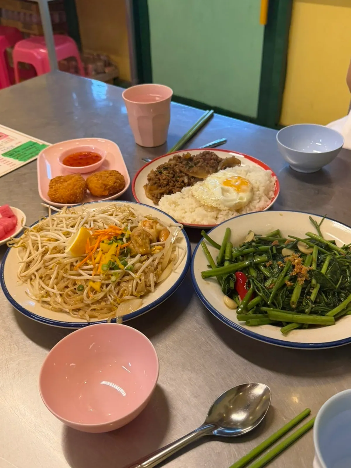 Table spread with four Thai dishes