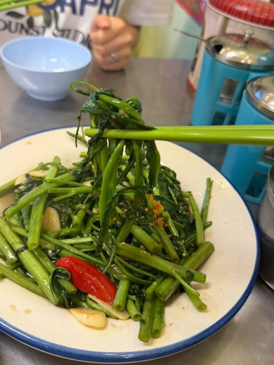 Close-up of crunchy stir-fried water spinach