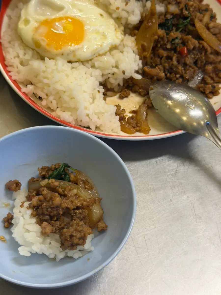 Close-up of basil pork stir-fry rice bowl
