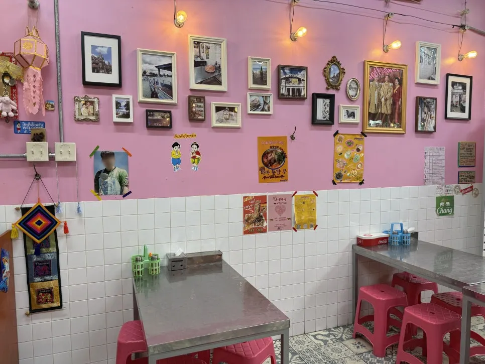 Pink walls and decor evoking a Thai back-alley eatery