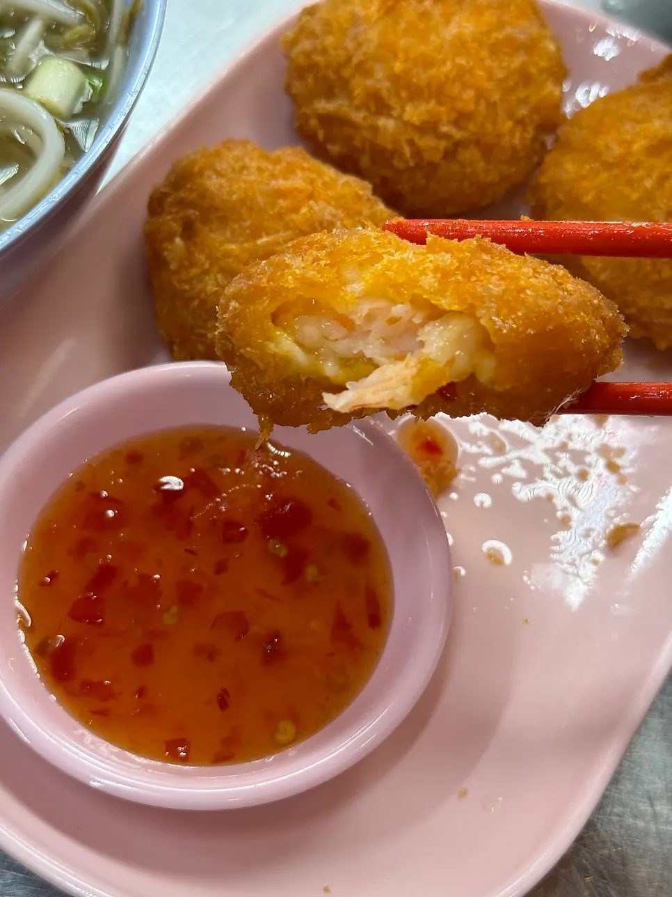 Cross-section of todman goong packed with minced shrimp