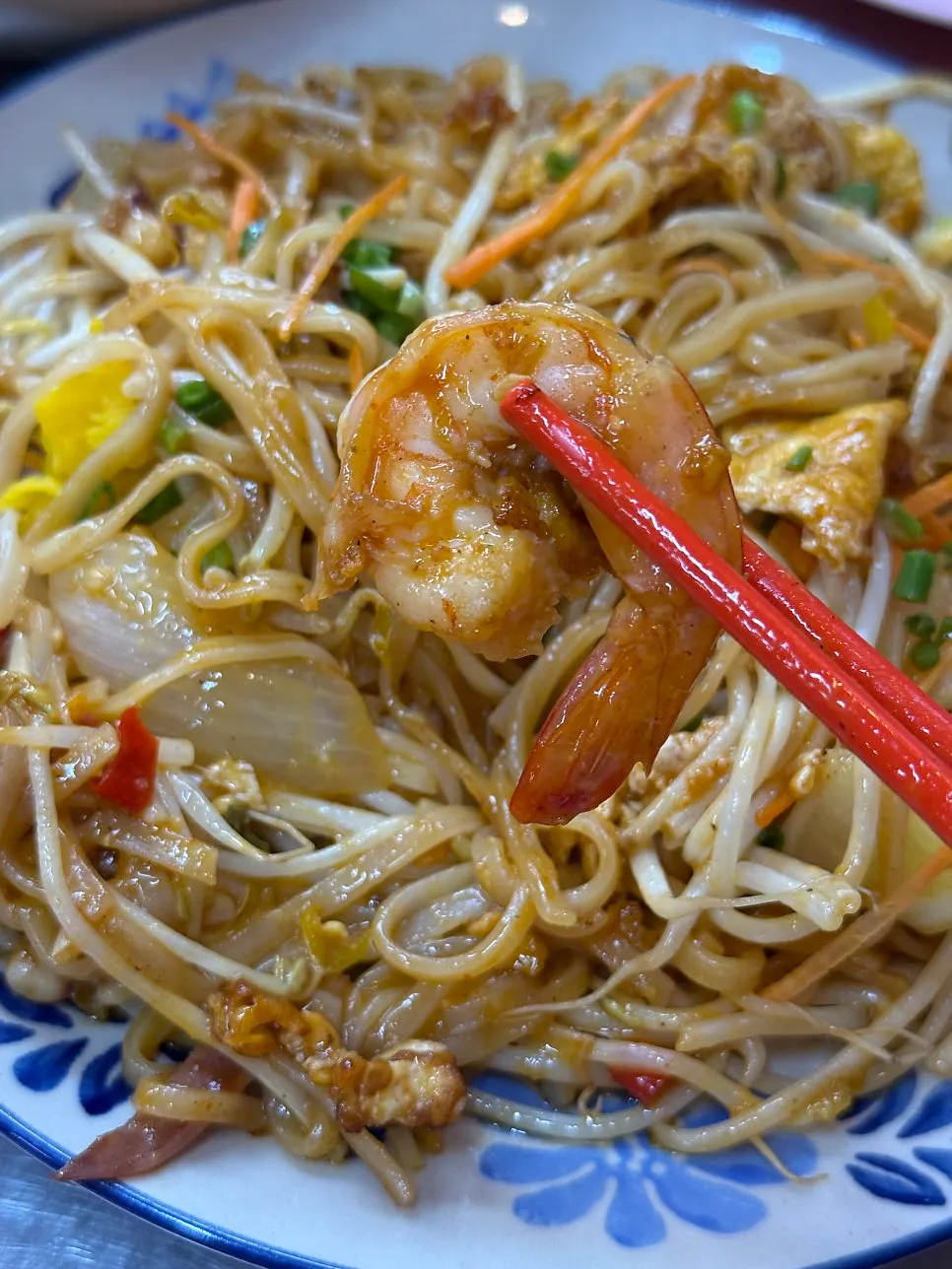 Seafood pad thai with bean sprouts and seafood mixed in
