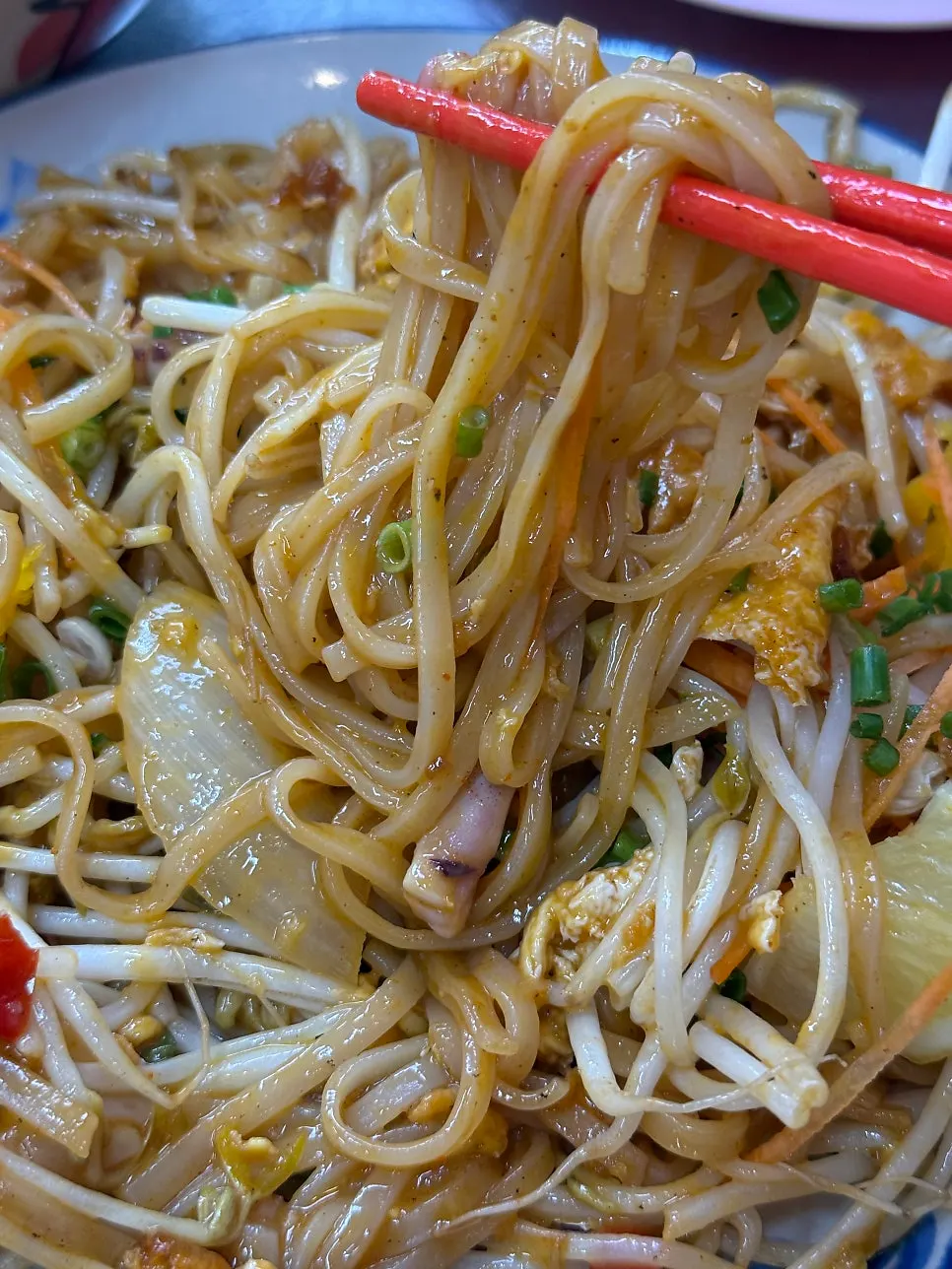 Chopsticks lifting pad thai noodles