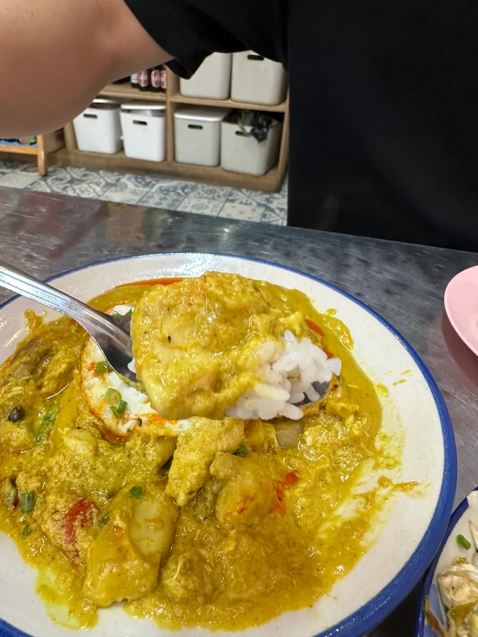 Morning glory served alongside a bowl of rice