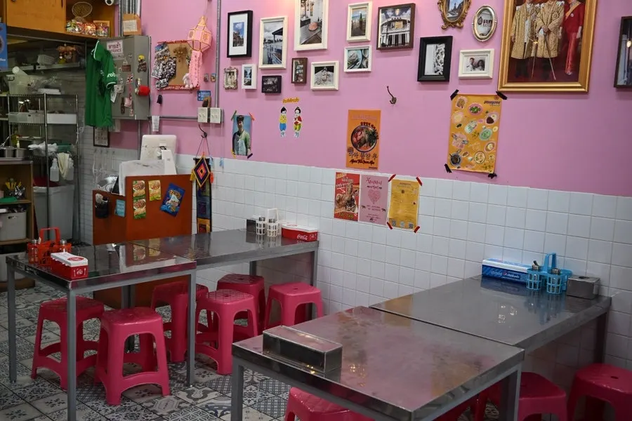 Interior of the restaurant decorated with photos of Thailand