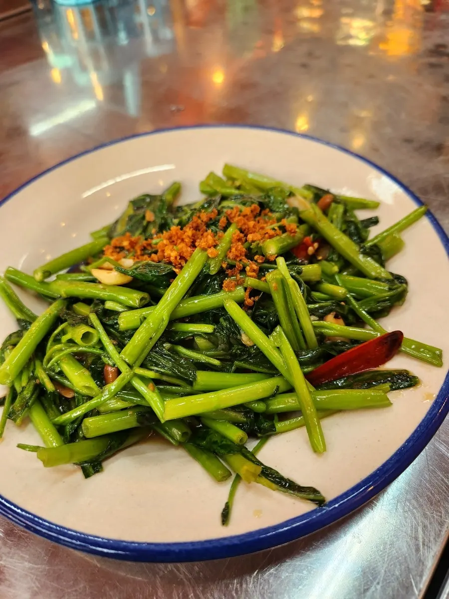 A plate of tod man goong with chili sauce