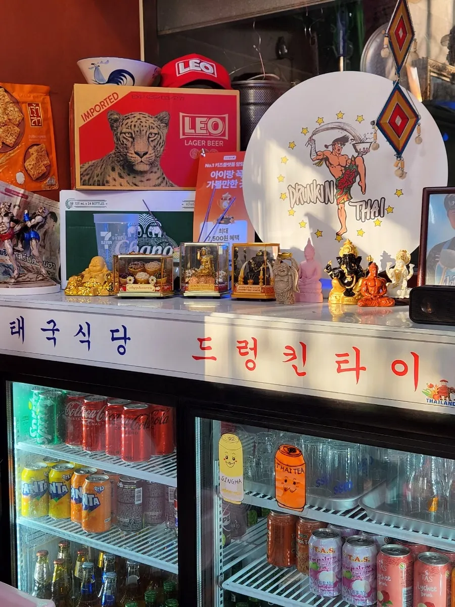 Thai beer placed alongside Thai dishes on the table