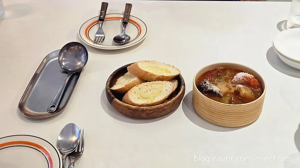 Goulash served with bread and a ladle