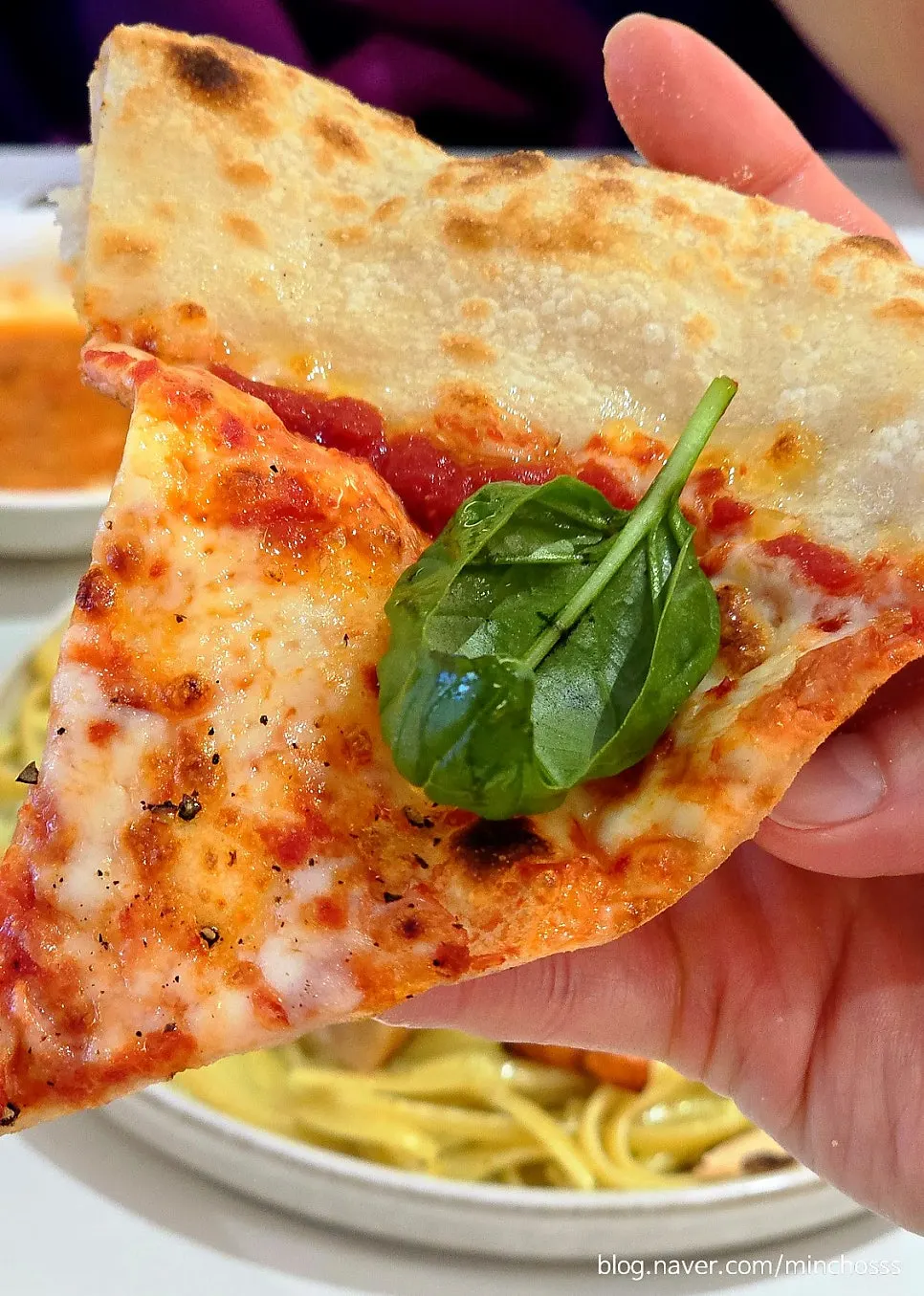Cross-section of the thin, chewy margherita dough