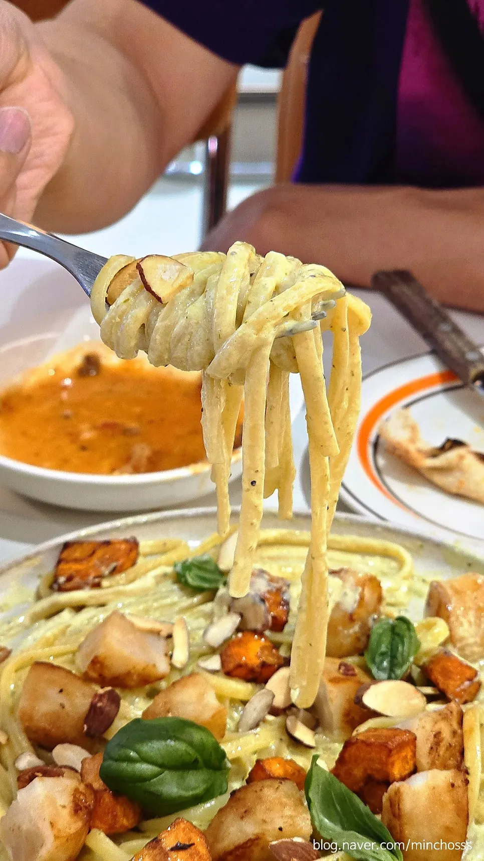 Linguine coated in thick basil cream sauce