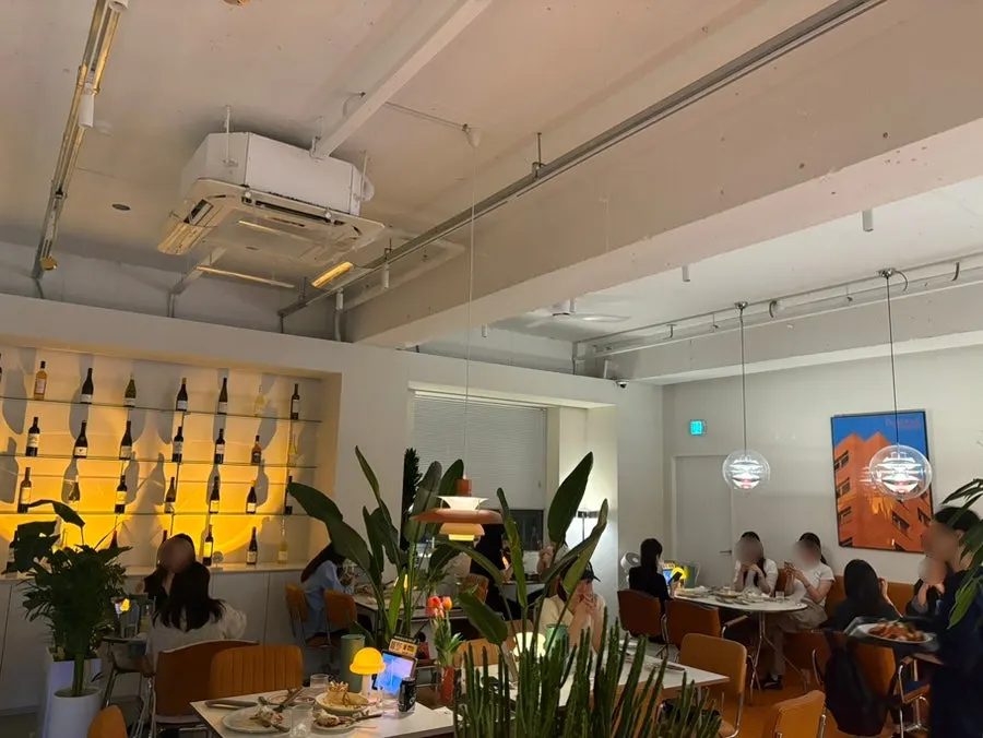 Interior decor with orange-toned furniture and plants