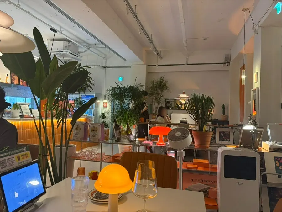 Corner of the Dooblock dining hall decorated with green plants