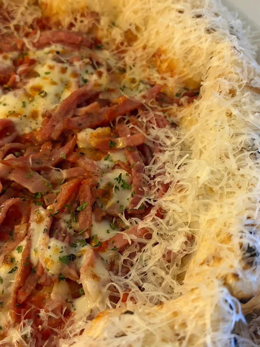 Close-up of a diavola pizza slice