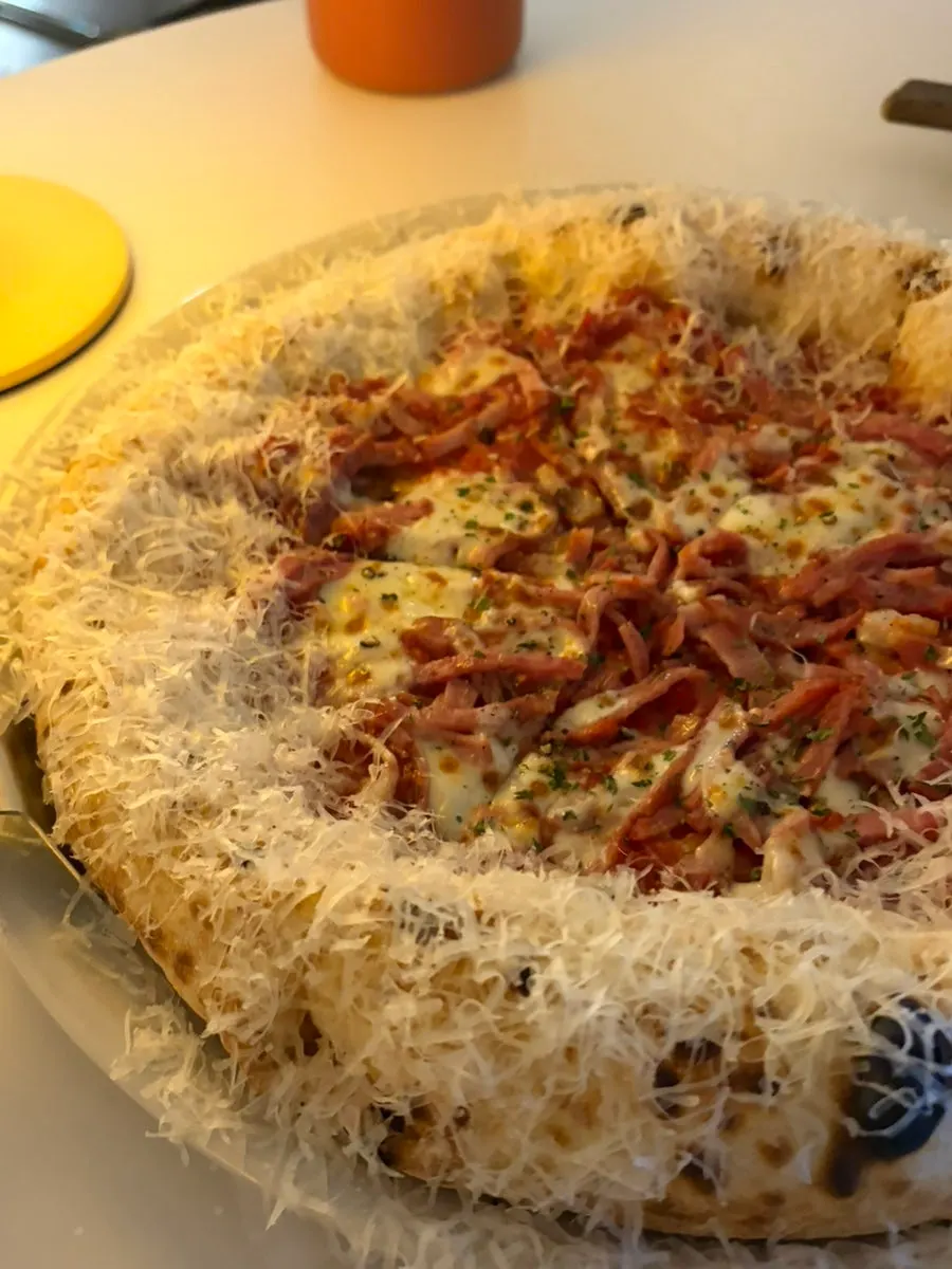 Cross-section of the diavola pizza showing generous cheese