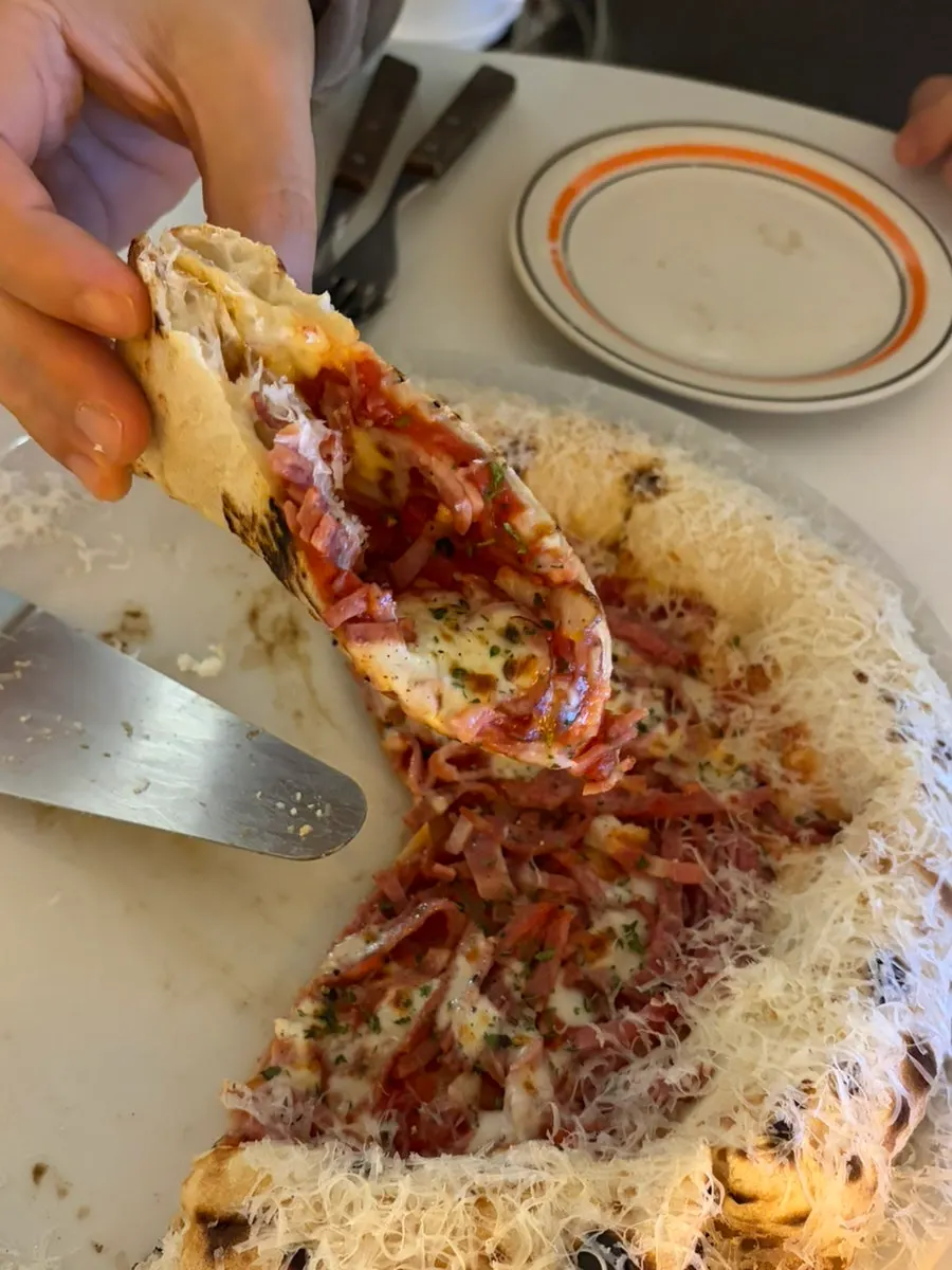 Pizza slice showing the chewy crust
