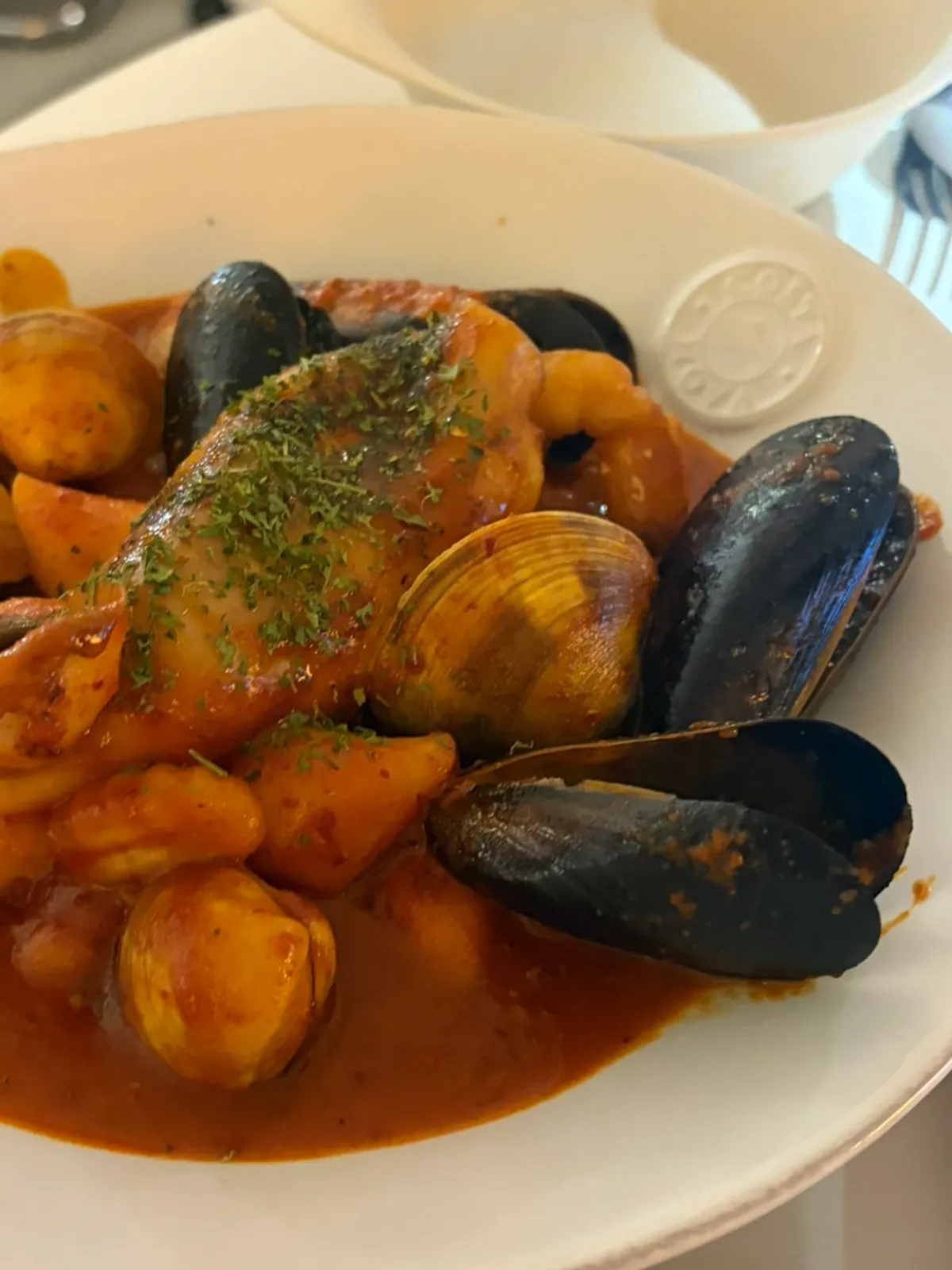Gnocchi tteokbokki topped with whole squid