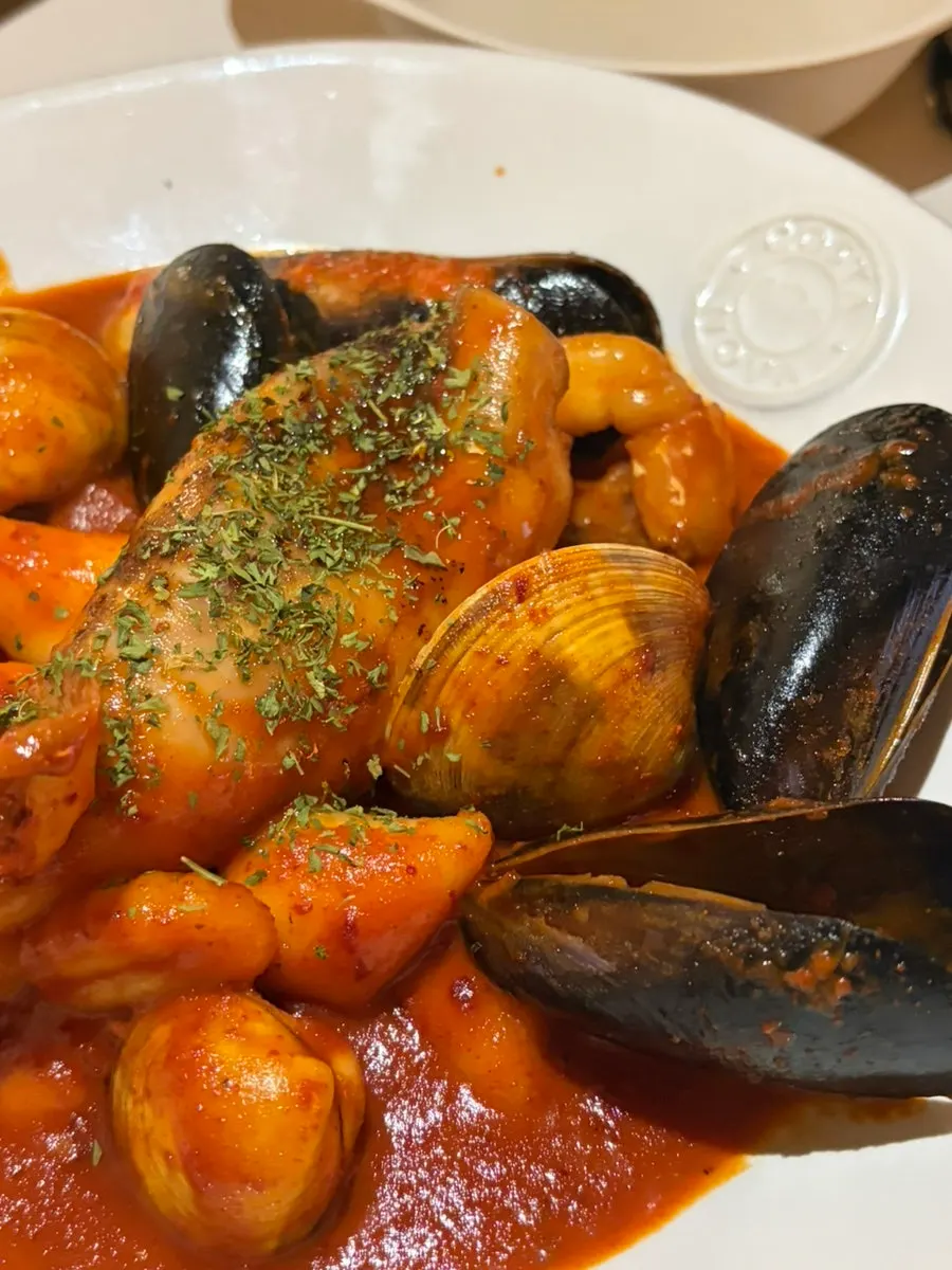 Whole squid gnocchi tteokbokki in spicy sauce