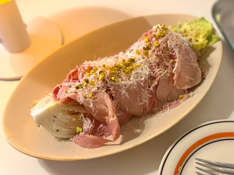 Plate of jambon cabbage salad on the table