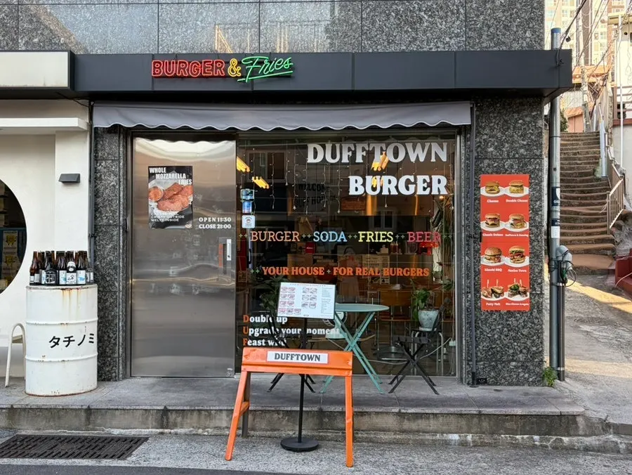 Classic Deluxe, Double Cheese Burger and Sweet Potato Fries order spread