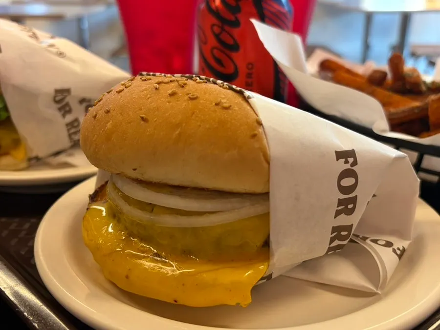 Double Cheese Burger with cheese dripping down