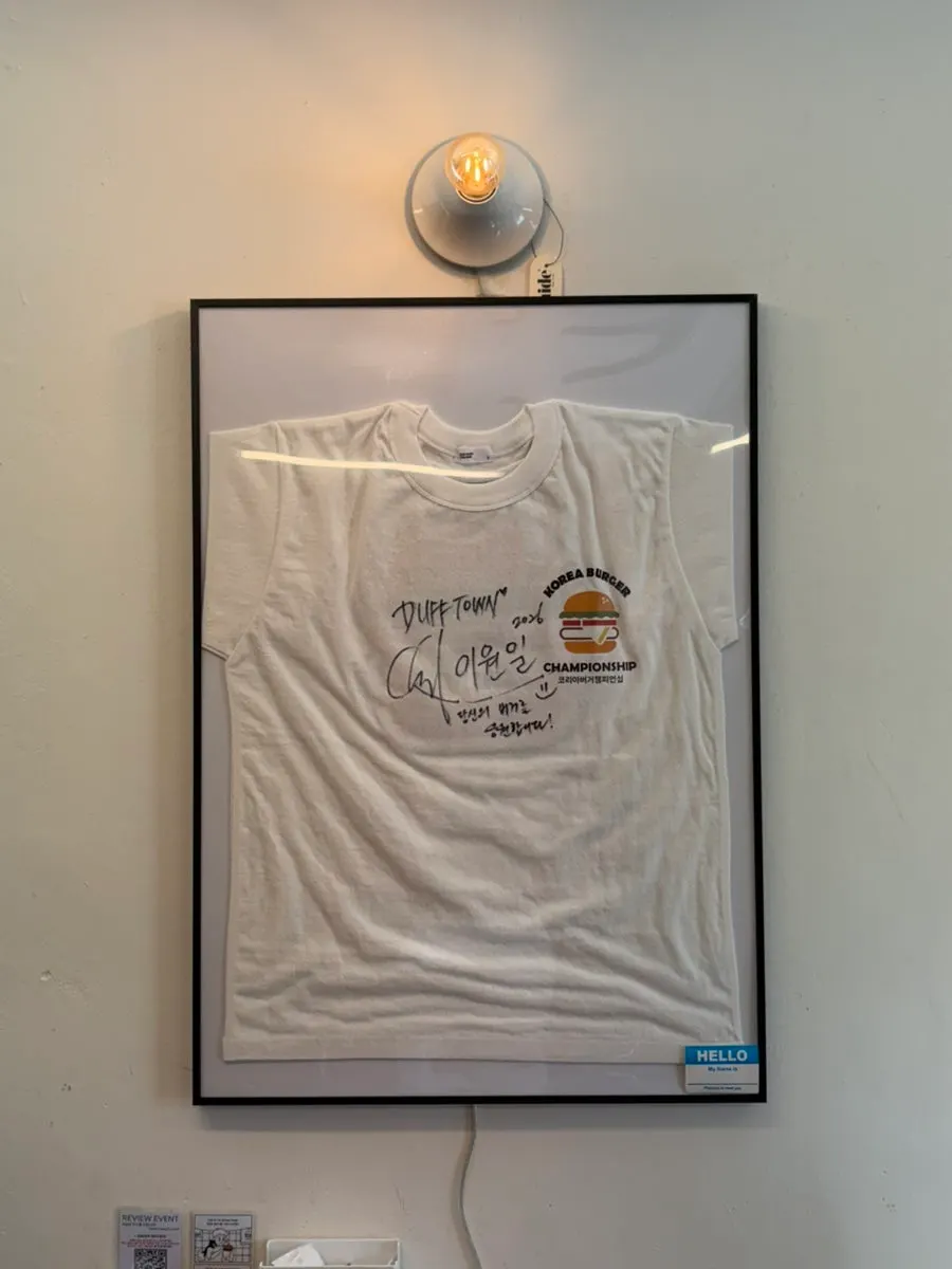 Wall at Dufftown Burger hung with signs and decorations