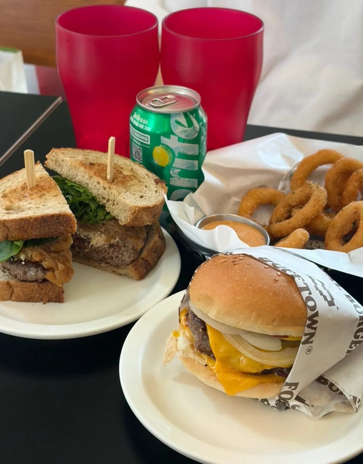 A full spread of burger and side dishes at Dufftown Burger Jeonpo Main Branch