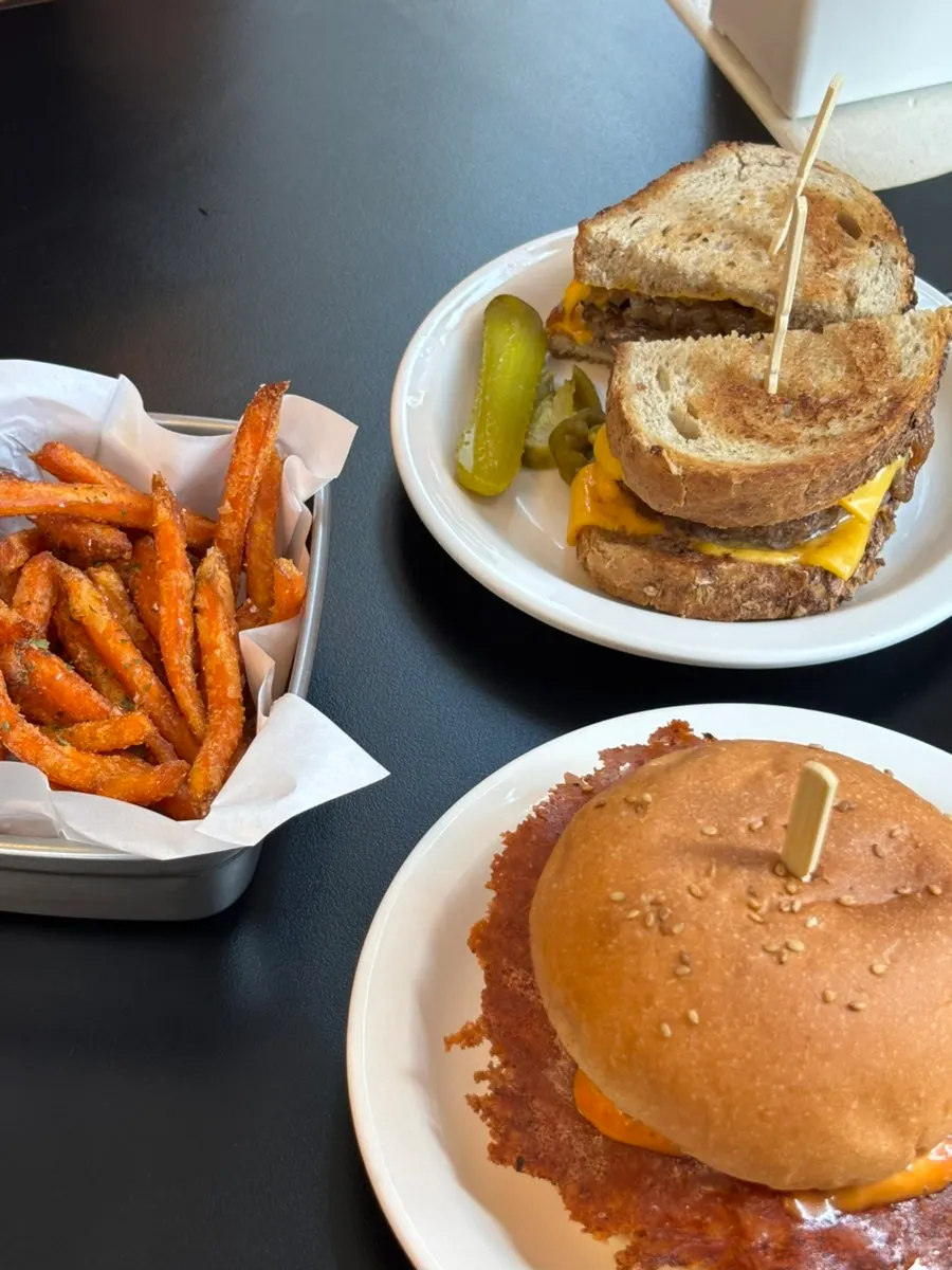 Burger plate served with jalapeños and pickles