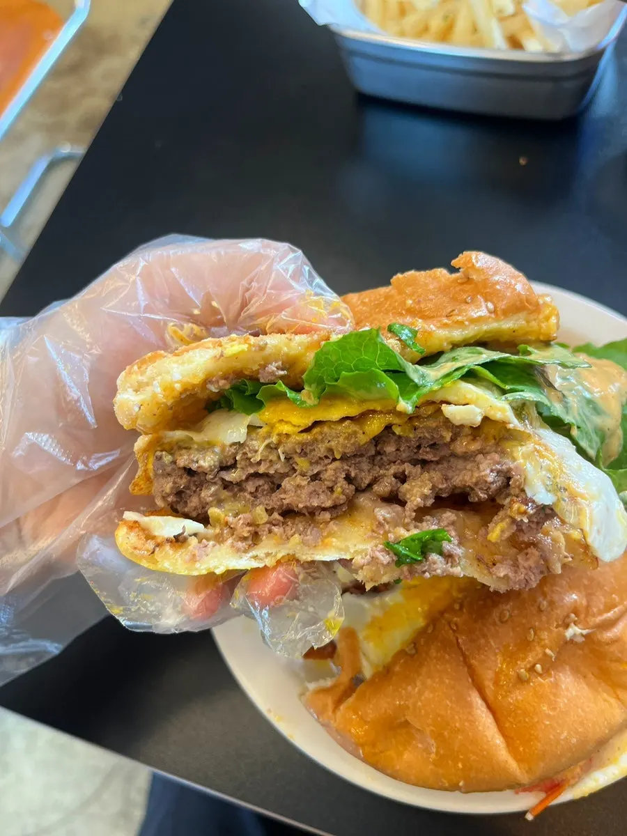 Inside of the burger showing a large chunky egg