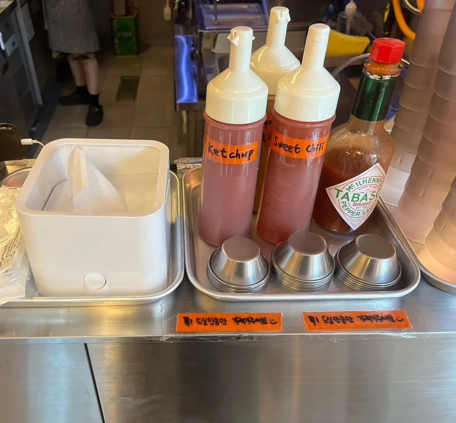 Self bar with disposable gloves, wet wipes, and ketchup
