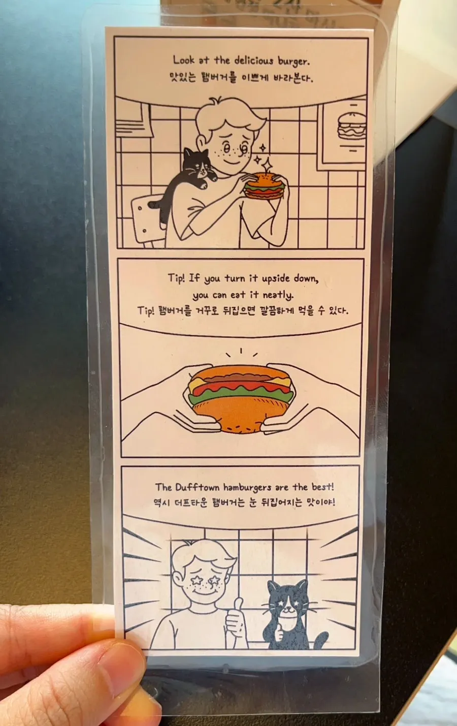 Table sign showing tips on how to eat the burger