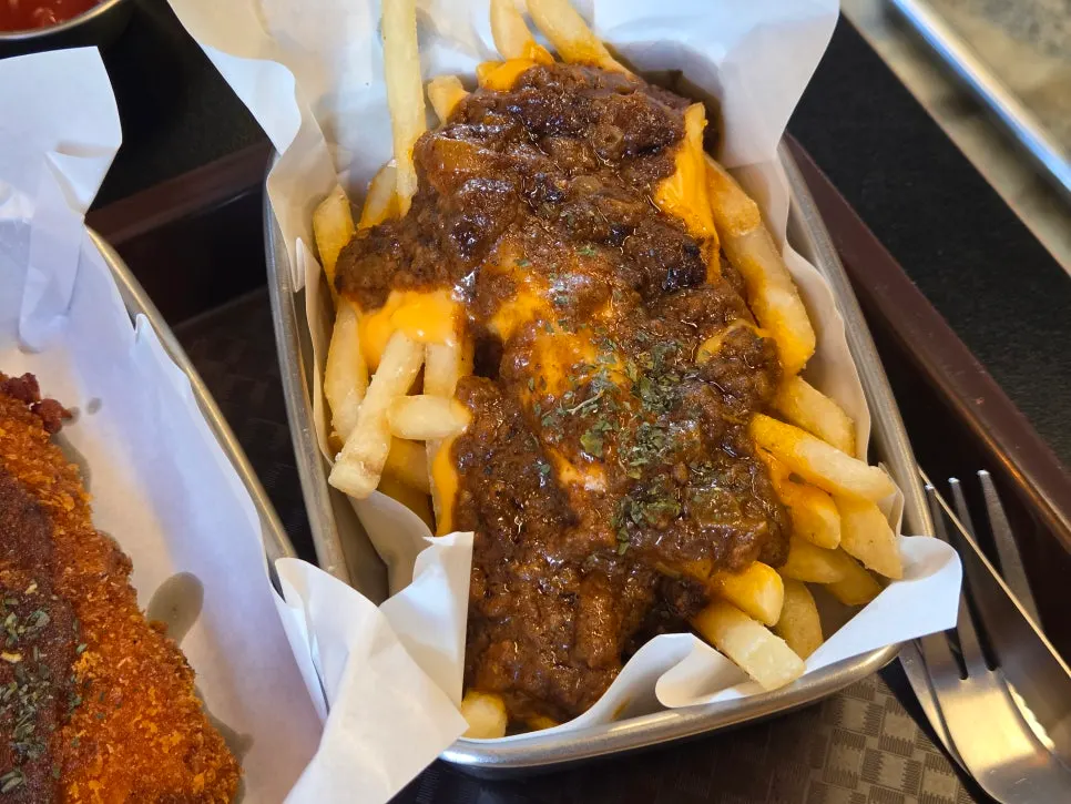 Chili cheese fries topped with chili and cheese