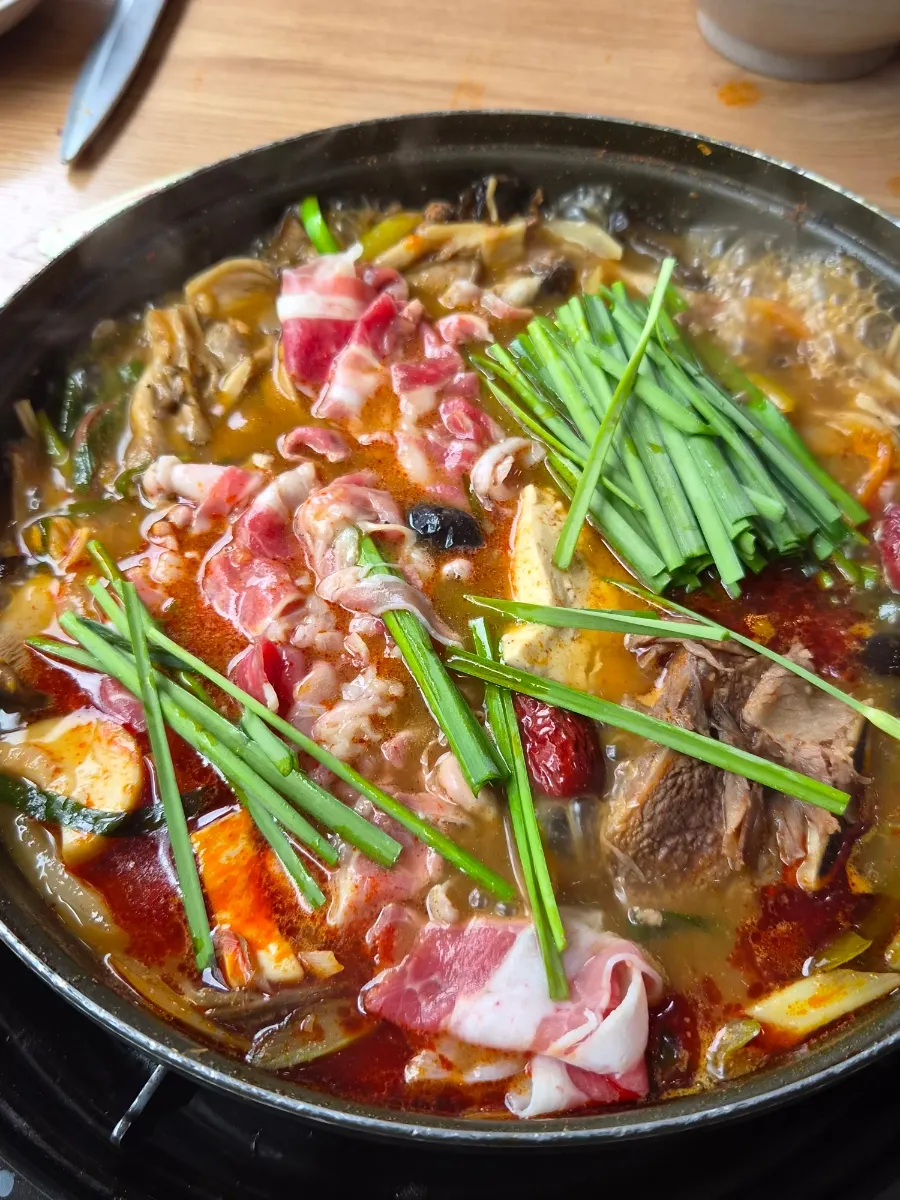 Spicy teukjeon-gol broth bubbling away