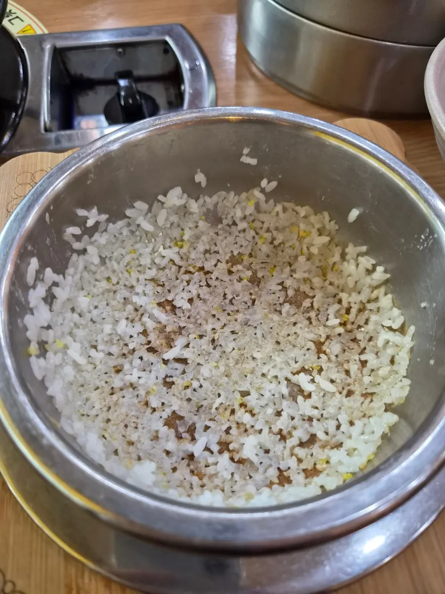 Barley tea poured into the pot to make nurungji