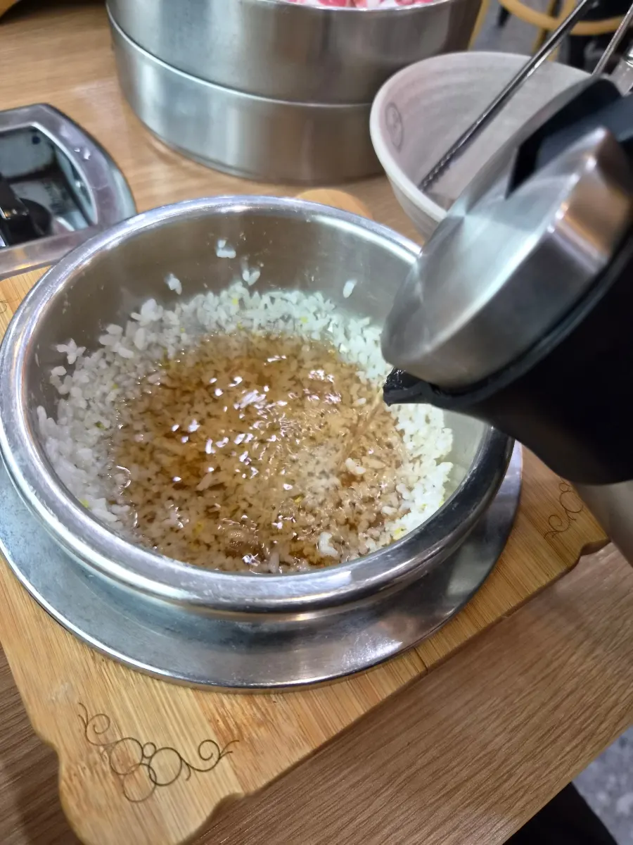 Freshly cooked pot rice scooped out