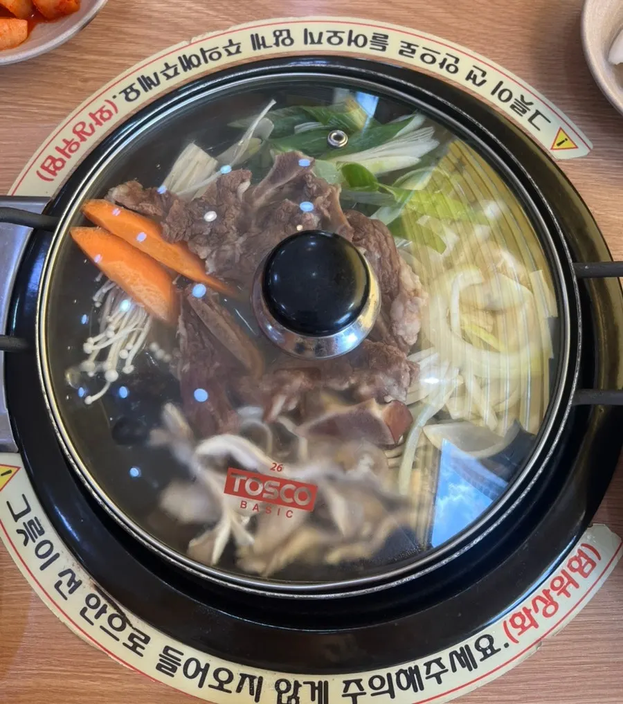 Pot of usinjeongol with rib bones and vegetables