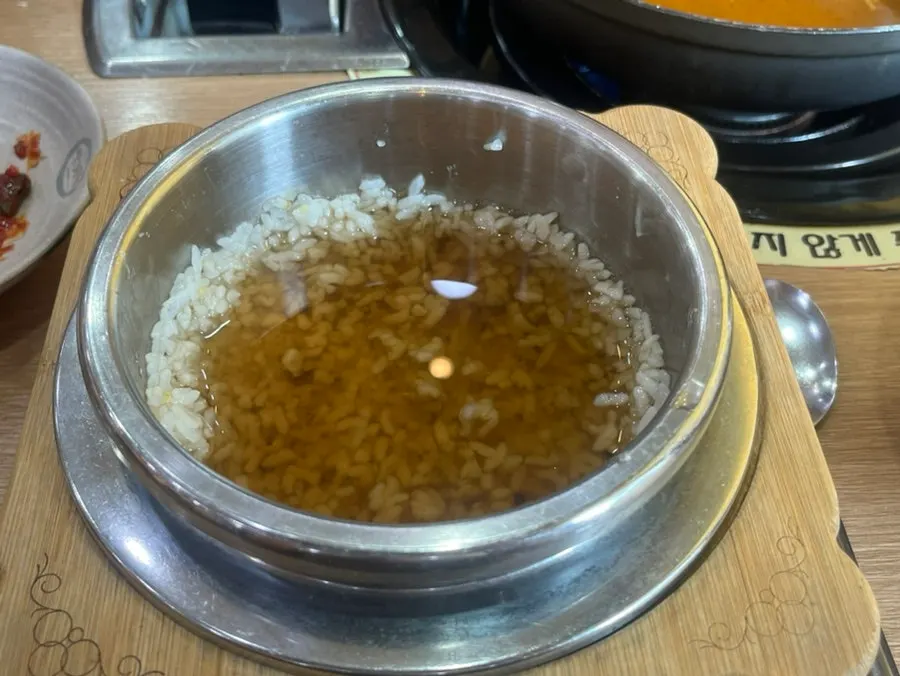 Extra bowl of rice ordered alongside the hot pot
