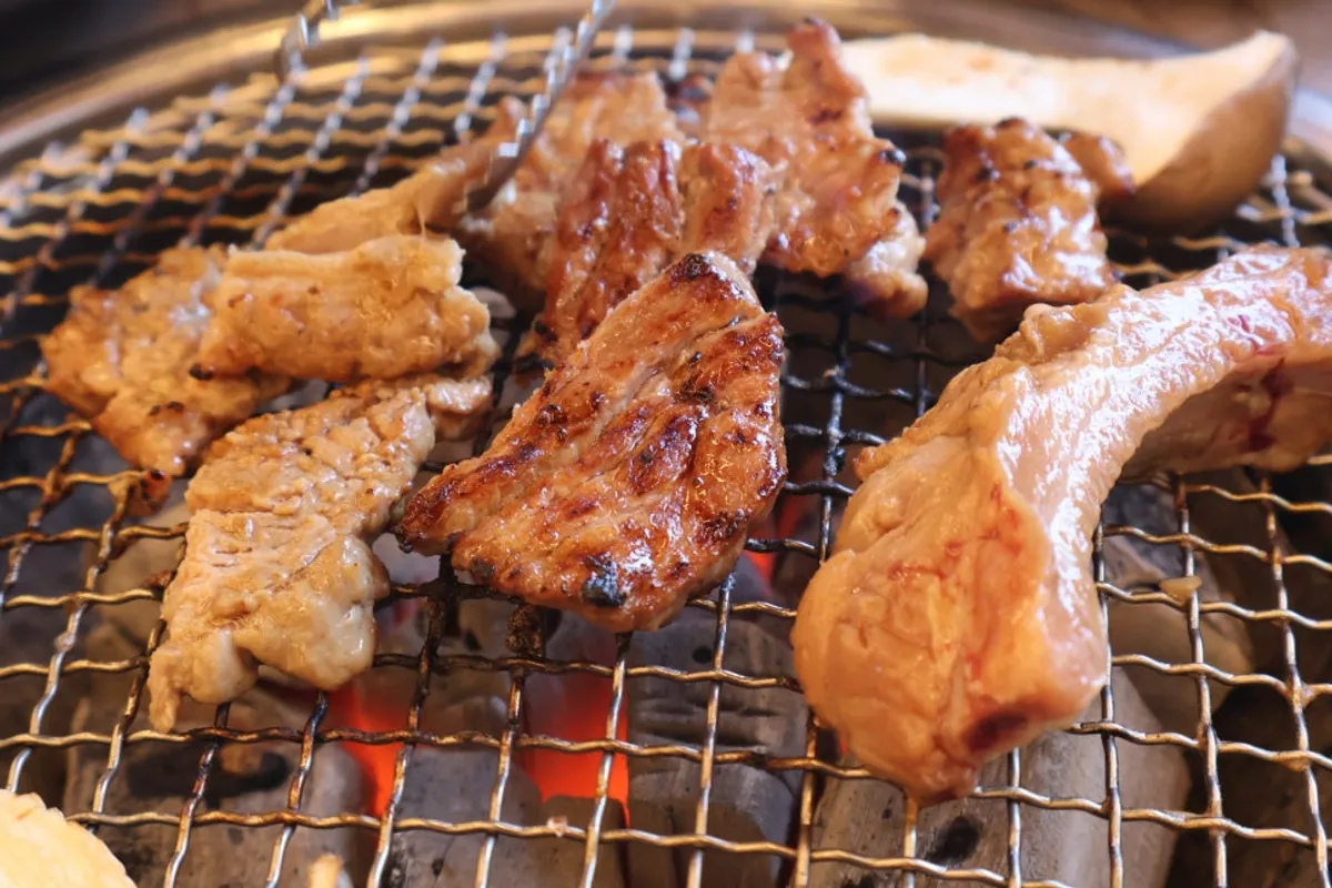 Table spread of seasoned pork galbi at Dugeundugeun Sutbulgalbi