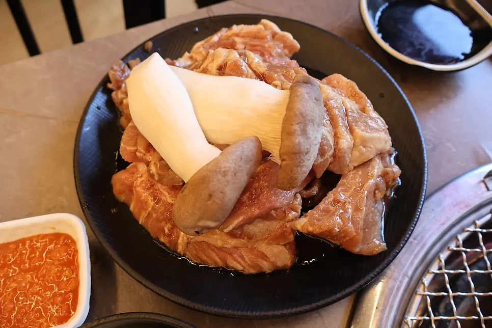 Table set with side dishes and sundubu jjigae